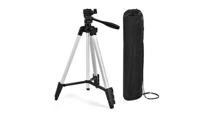 A silver and black adjustable camera tripod with a black carrying bag, used to mount the alignment laser for the Lower Back Reset Method to ensure accurate body symmetry measurements.